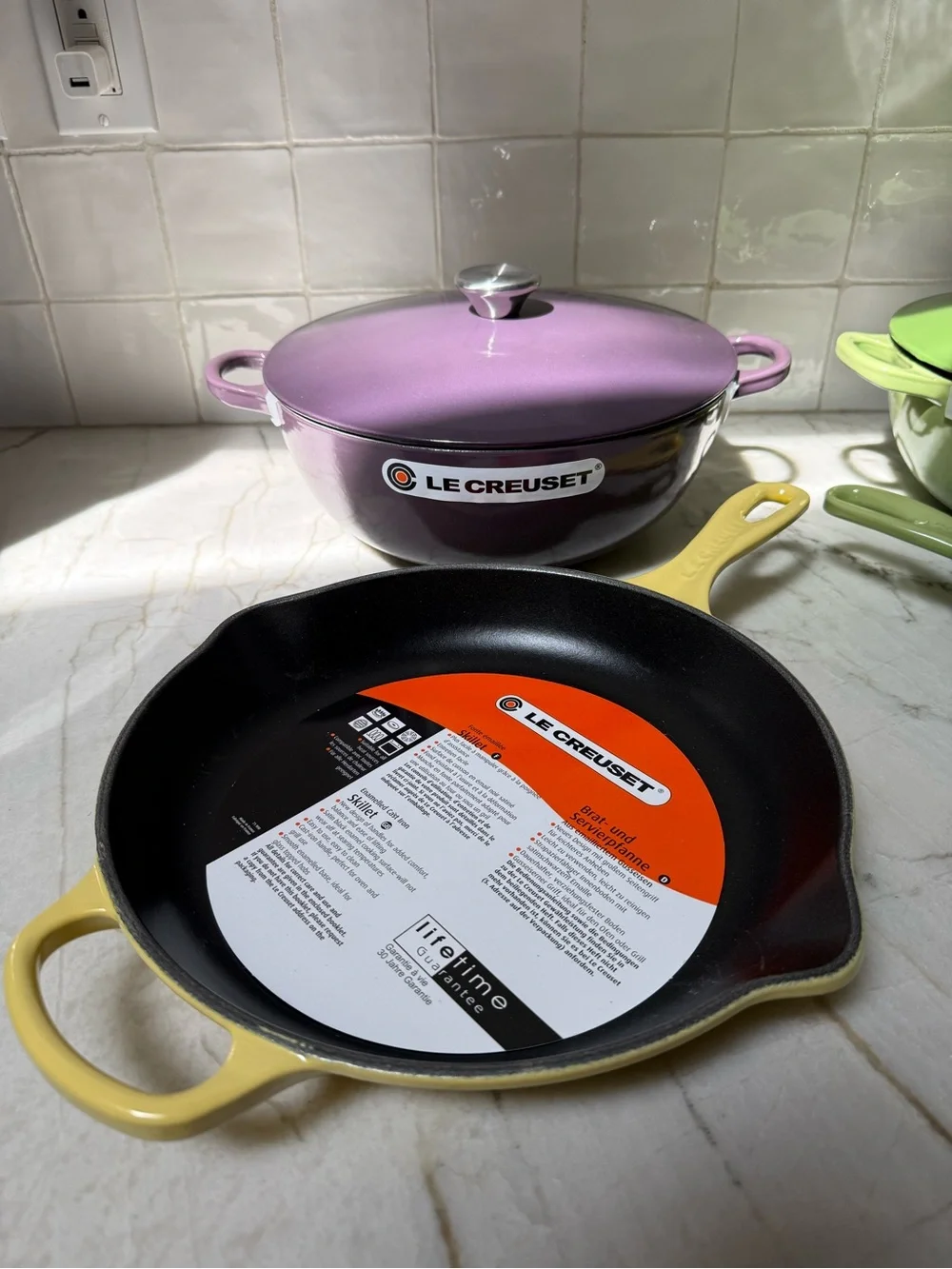 Le Creuset Purple, Yellow, and Green Cast Iron Cookware Set
